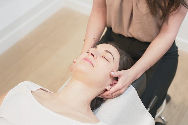 Chiropractor performing a gentle neck adjustment on a patient, demonstrating hands-on chiropractic care at Radiant Chiropractic in Canterbury, Eastern Melbourne.